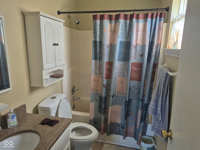 full bath with vanity, shower / bath combo with shower curtain, and toilet