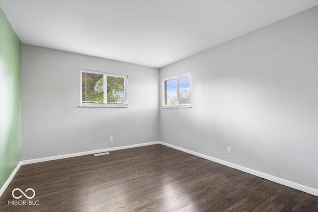 5719 Laurel Hall Dr, Indianapolis, IN 46226 - empty room with baseboards and wood finished floors