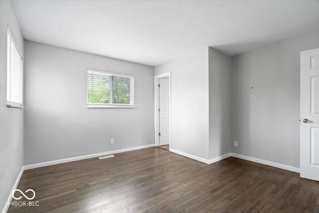 5719 Laurel Hall Dr, Indianapolis, IN 46226 - empty room featuring dark wood finished floors and baseboards