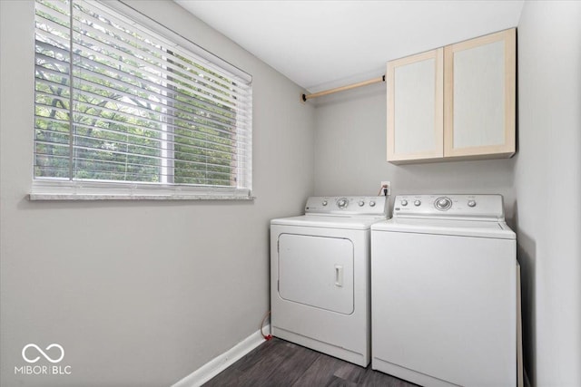 5719 Laurel Hall Dr, Indianapolis, IN 46226 - washroom featuring cabinet space, separate washer and dryer, dark wood-style floors, and baseboards
