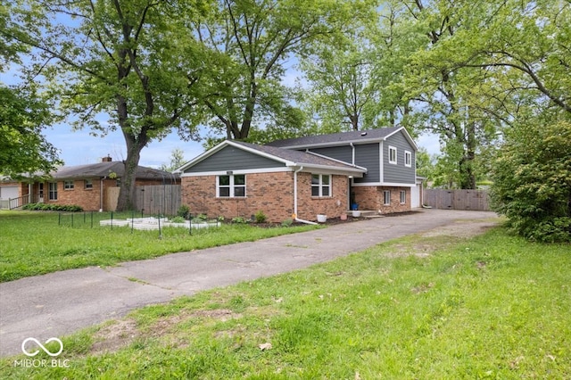 5719 Laurel Hall Dr, Indianapolis, IN 46226 - tri-level home with brick siding and driveway