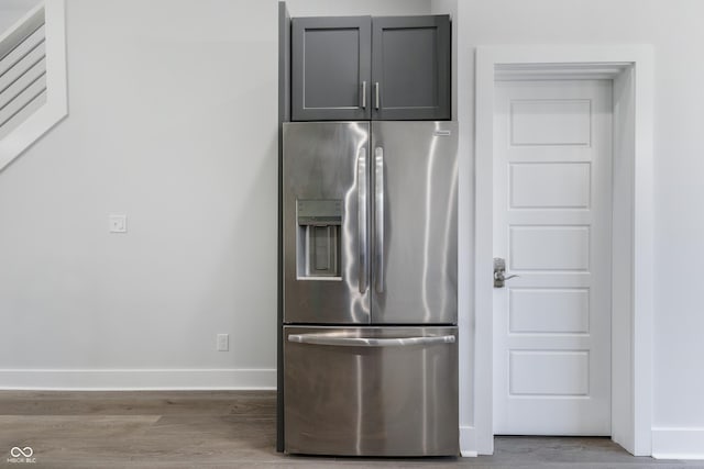 2226 Central Ave, Indianapolis, IN 46205 - kitchen featuring baseboards, wood finished floors, gray cabinetry, and stainless steel fridge with ice dispenser