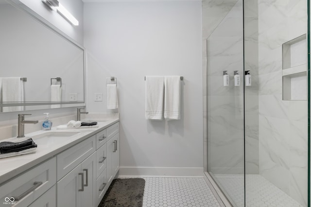 2226 Central Ave, Indianapolis, IN 46205 - full bathroom with a marble finish shower, double vanity, a sink, and baseboards