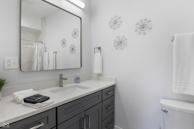 2226 Central Ave, Indianapolis, IN 46205 - bathroom featuring a shower with shower curtain, toilet, and vanity