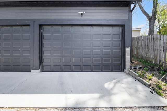 2226 Central Ave, Indianapolis, IN 46205 - garage with fence and concrete driveway
