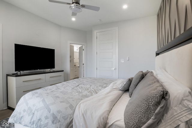 2226 Central Ave, Indianapolis, IN 46205 - bedroom with connected bathroom, wood finished floors, ceiling fan, and recessed lighting
