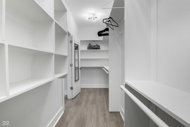 2226 Central Ave, Indianapolis, IN 46205 - walk in closet with wood finished floors
