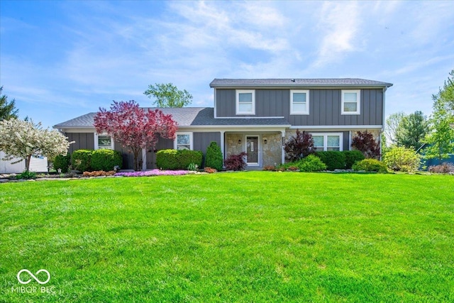 traditional-style home featuring board and batten siding and a front yard