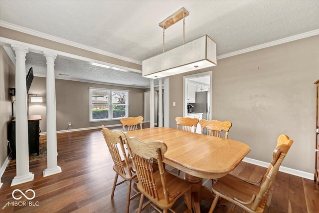 dining space featuring ornate columns, baseboards, and dark wood-style floors