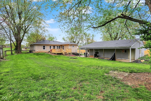 view of yard with a deck and a fenced backyard