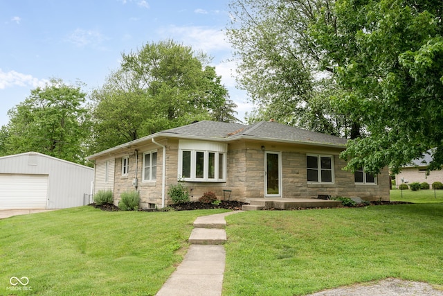 840 N Indiana St, Mooresville, IN 46158 - view of front of house featuring stone siding, a detached garage, an outdoor structure, a front lawn, and a shingled roof