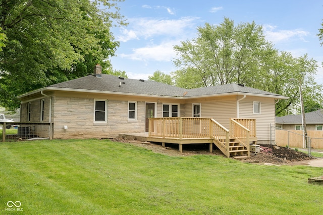 840 N Indiana St, Mooresville, IN 46158 - rear view of property featuring a chimney, a deck, stone siding, and a shingled roof