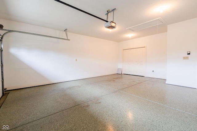 garage featuring a garage door opener