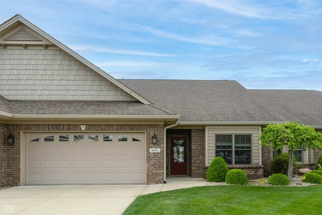 view of front of property with brick siding, a shingled roof, an attached garage, and concrete driveway