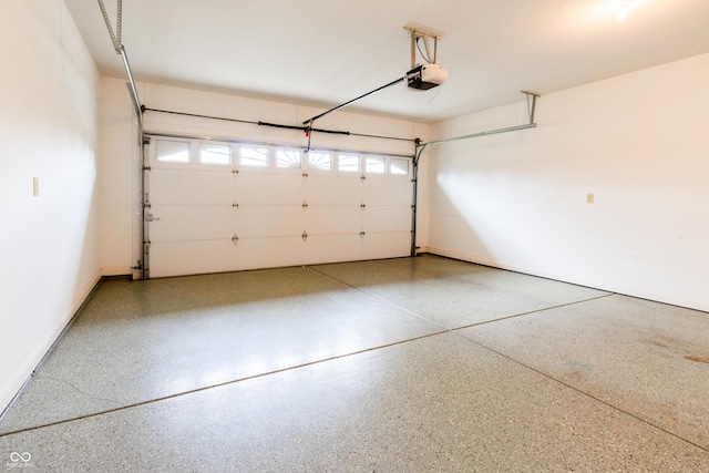 garage featuring baseboards and a garage door opener