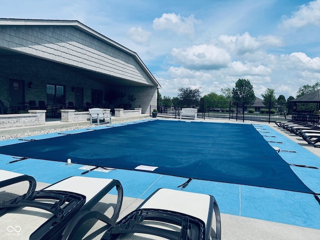 community pool featuring fence
