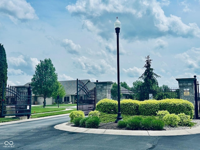 view of community with fence and a gate