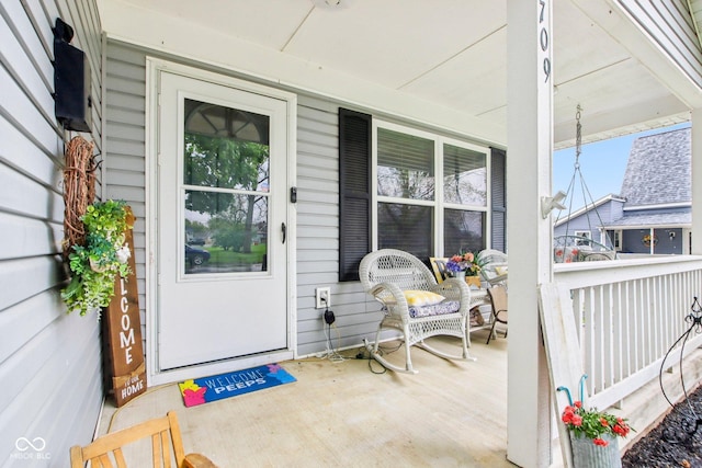 entrance to property featuring a porch