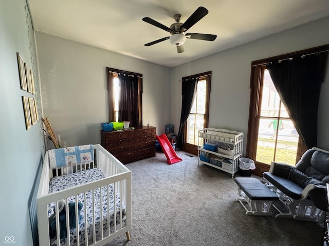 carpeted bedroom with a ceiling fan
