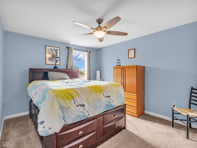 carpeted bedroom featuring ceiling fan and baseboards