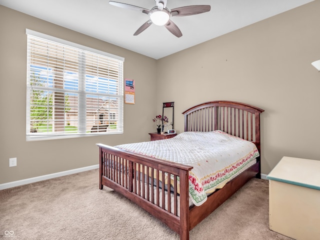 bedroom featuring ceiling fan, carpet, and baseboards