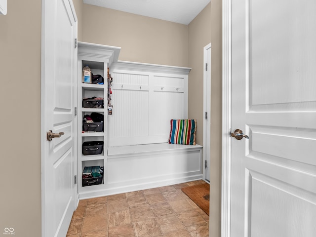 mudroom with stone finish flooring