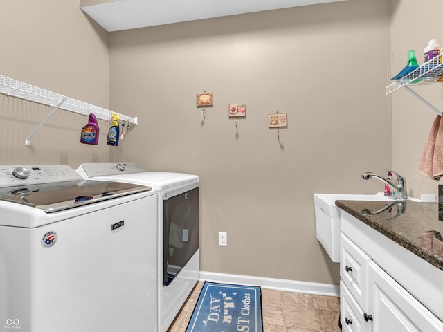 laundry area featuring independent washer and dryer and baseboards
