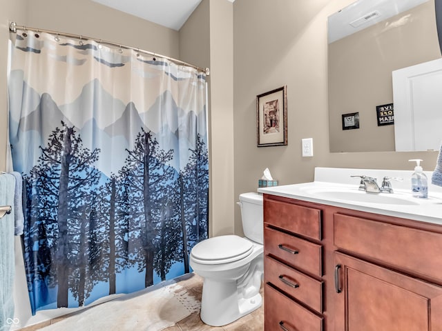 bathroom with tile patterned flooring, a shower with curtain, toilet, vanity, and visible vents