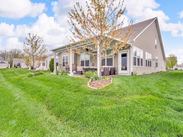rear view of property with an outdoor hangout area, a patio, and a yard