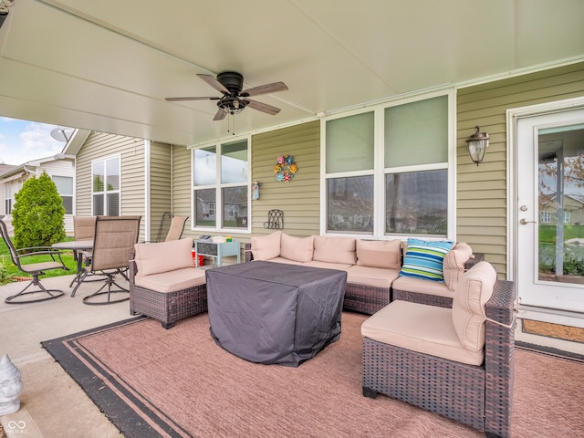 view of patio / terrace with an outdoor living space and a ceiling fan