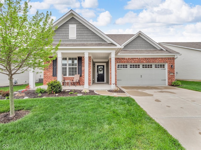 craftsman-style home featuring a front lawn, a garage, covered porch, brick siding, and concrete driveway