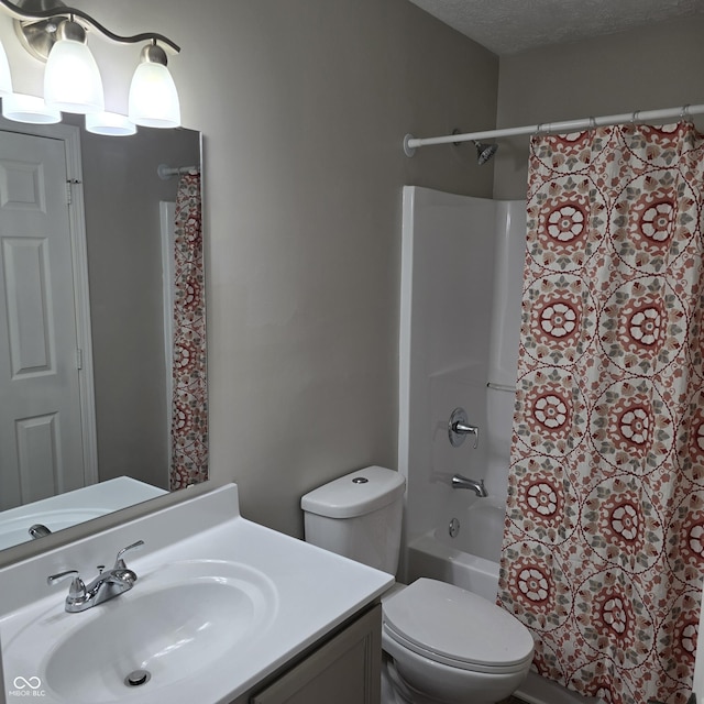 full bathroom featuring toilet, vanity, and shower / bath combination with curtain