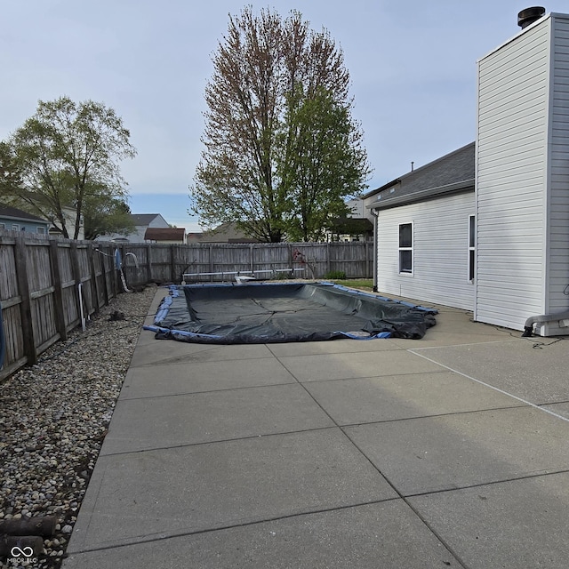 view of pool with a fenced in pool, a patio area, and a fenced backyard