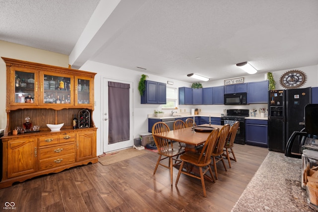 8211 Firefly Way, Indianapolis, IN 46259 - dining room with wood finished floors, a textured ceiling, and beam ceiling