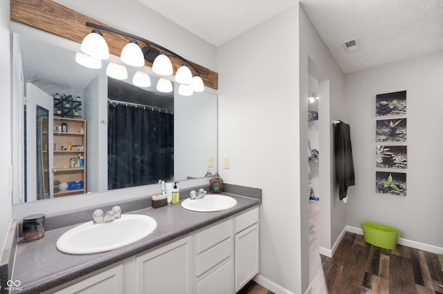 8211 Firefly Way, Indianapolis, IN 46259 - full bathroom featuring wood finished floors, double vanity, and baseboards