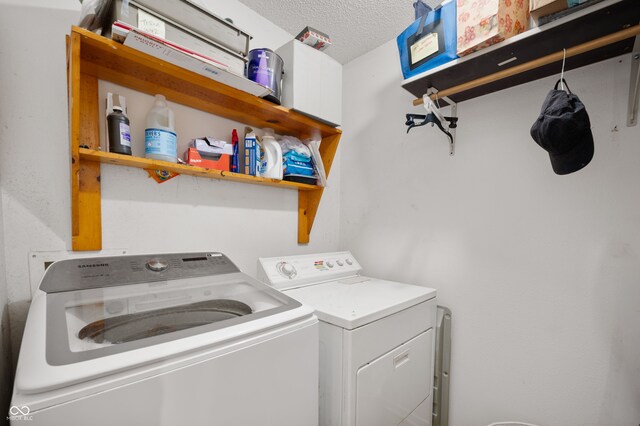 8211 Firefly Way, Indianapolis, IN 46259 - laundry room featuring independent washer and dryer and a textured ceiling