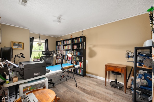8211 Firefly Way, Indianapolis, IN 46259 - home office featuring a textured ceiling, ornamental molding, wood finished floors, a ceiling fan, and baseboards