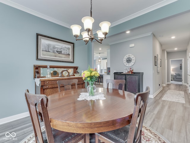 3697 Chalmers Dr, Bargersville, IN 46106 - dining area with a chandelier, baseboards, light wood-style floors, recessed lighting, and ornamental molding