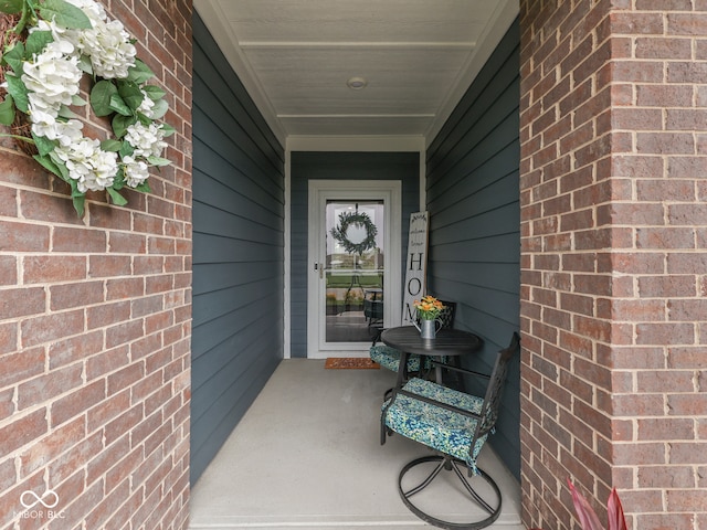 3697 Chalmers Dr, Bargersville, IN 46106 - view of exterior entry featuring brick siding and a porch