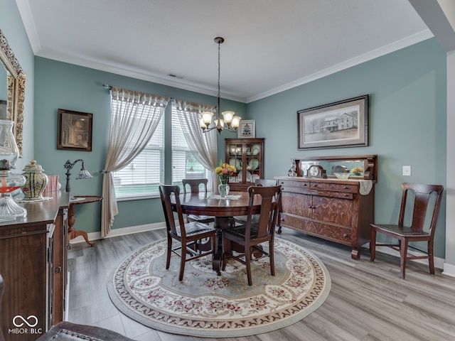 3697 Chalmers Dr, Bargersville, IN 46106 - dining area with a chandelier, light wood-style floors, baseboards, and ornamental molding