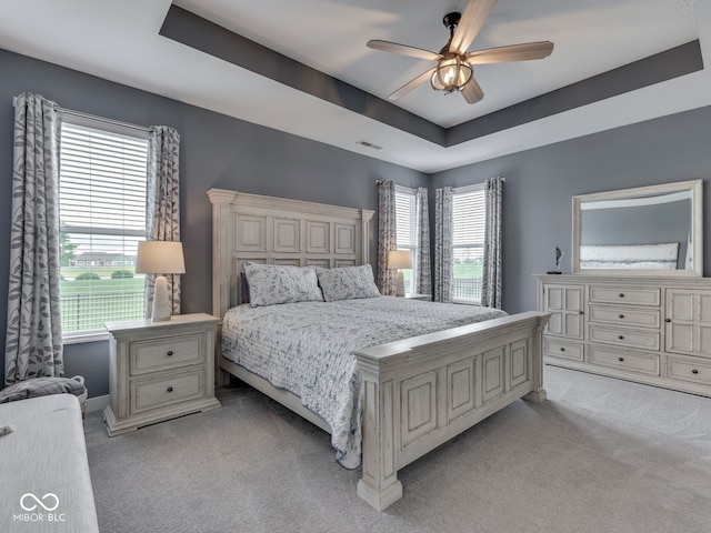 3697 Chalmers Dr, Bargersville, IN 46106 - bedroom with light colored carpet, a raised ceiling, baseboards, and ceiling fan