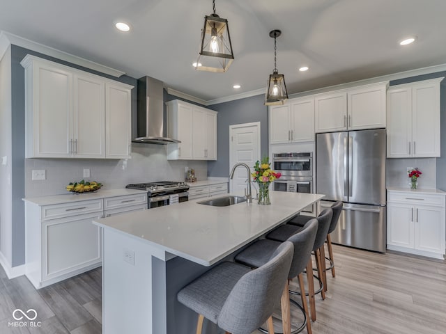 3697 Chalmers Dr, Bargersville, IN 46106 - kitchen with stainless steel appliances, wall chimney range hood, a sink, a kitchen breakfast bar, and a center island with sink