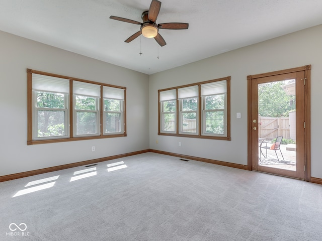 3601 Lakeshore Ct, Greenwood, IN 46143 - unfurnished room featuring healthy amount of natural light, light carpet, and a ceiling fan