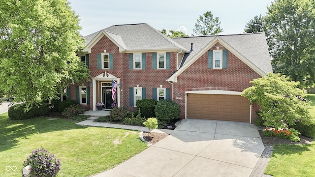 3601 Lakeshore Ct, Greenwood, IN 46143 - view of front of property with concrete driveway, brick siding, a front lawn, and roof with shingles