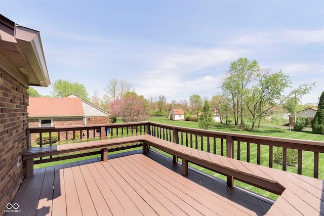 7901 Oaklandon Rd, Indianapolis, IN 46236 - deck featuring a storage unit, a lawn, and an outbuilding