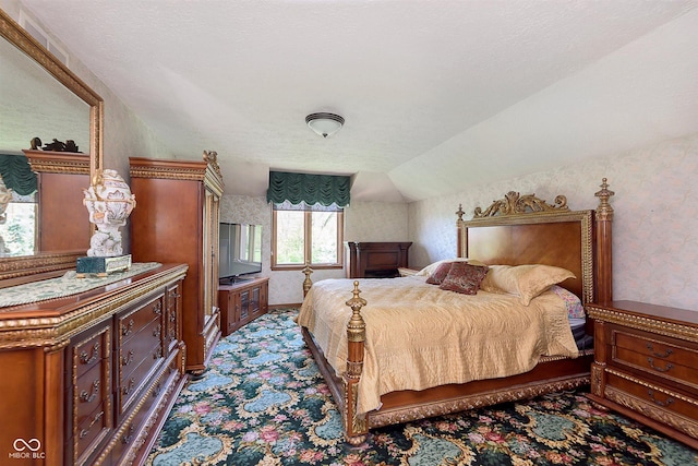 7901 Oaklandon Rd, Indianapolis, IN 46236 - bedroom featuring wallpapered walls, vaulted ceiling, and carpet