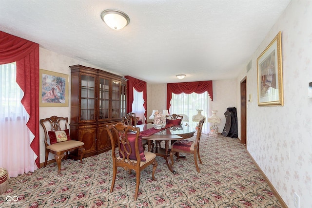 7901 Oaklandon Rd, Indianapolis, IN 46236 - carpeted dining space with a textured ceiling and wallpapered walls