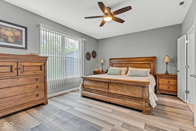 4809 Ozark Ln, Indianapolis, IN 46239 - bedroom with visible vents, light wood-type flooring, and a ceiling fan