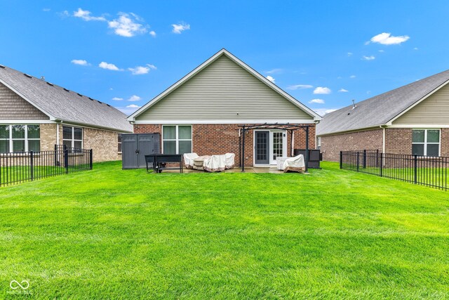 4809 Ozark Ln, Indianapolis, IN 46239 - rear view of house with a lawn, brick siding, and a fenced backyard
