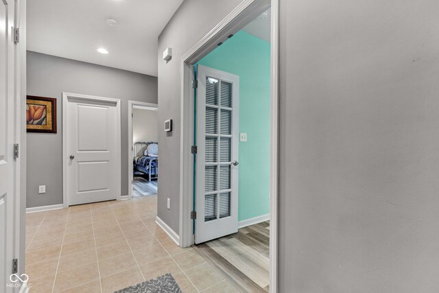 4809 Ozark Ln, Indianapolis, IN 46239 - hall with light tile patterned flooring, recessed lighting, and baseboards